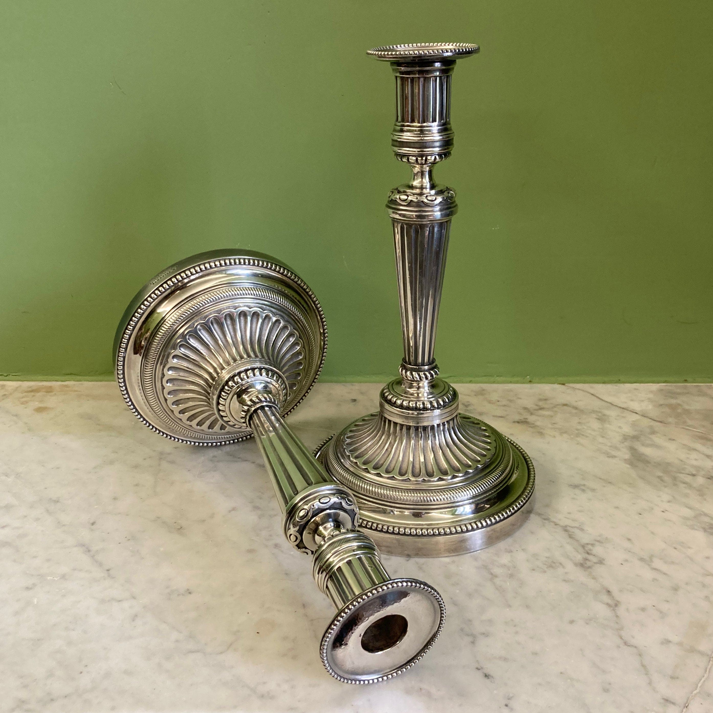 Pair of silvered bronze candlesticks from the 19th century in Louis XVI style signed Voisenet.
