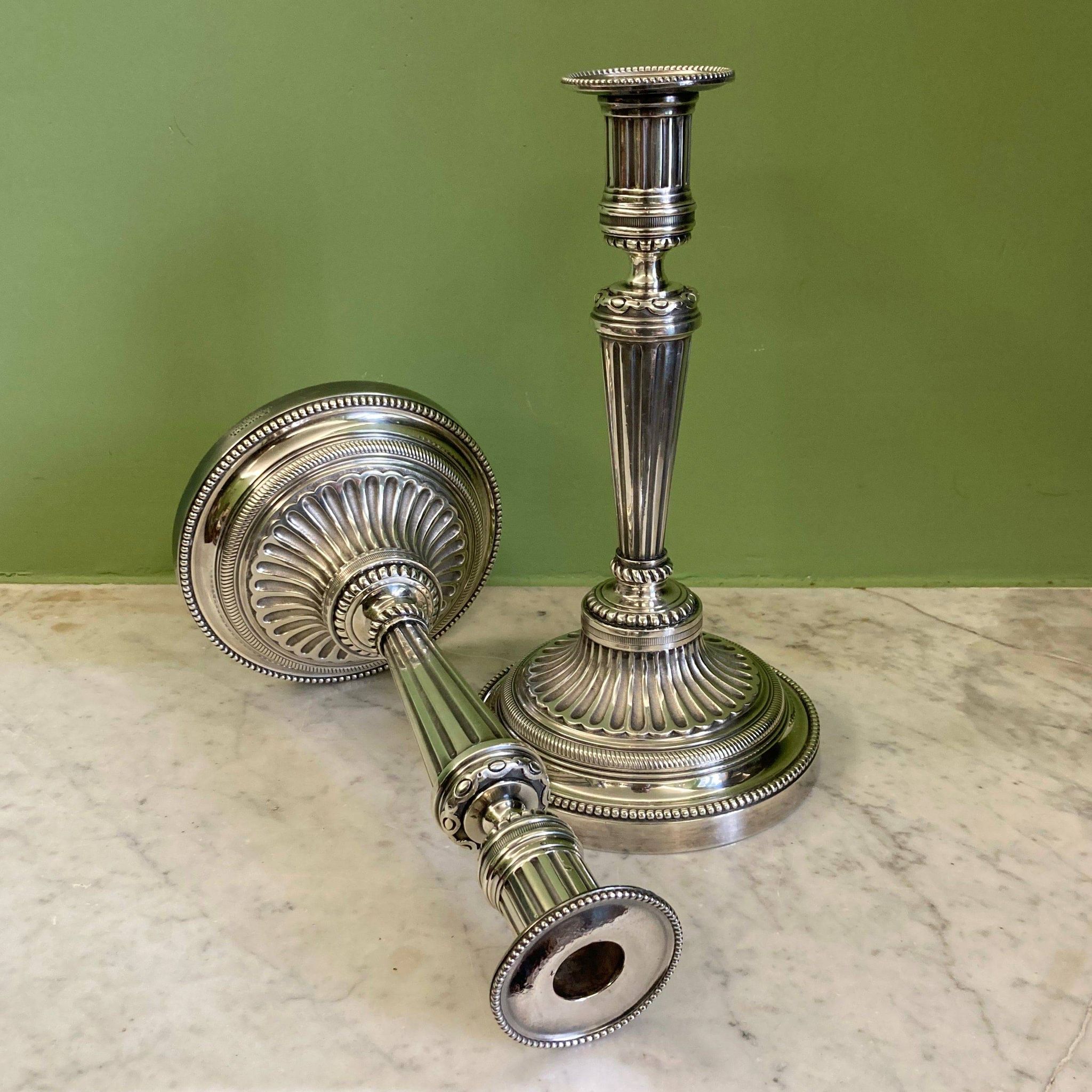 Pair of silvered bronze candlesticks in the Louis XVI style signed Voisenet, 19th century.