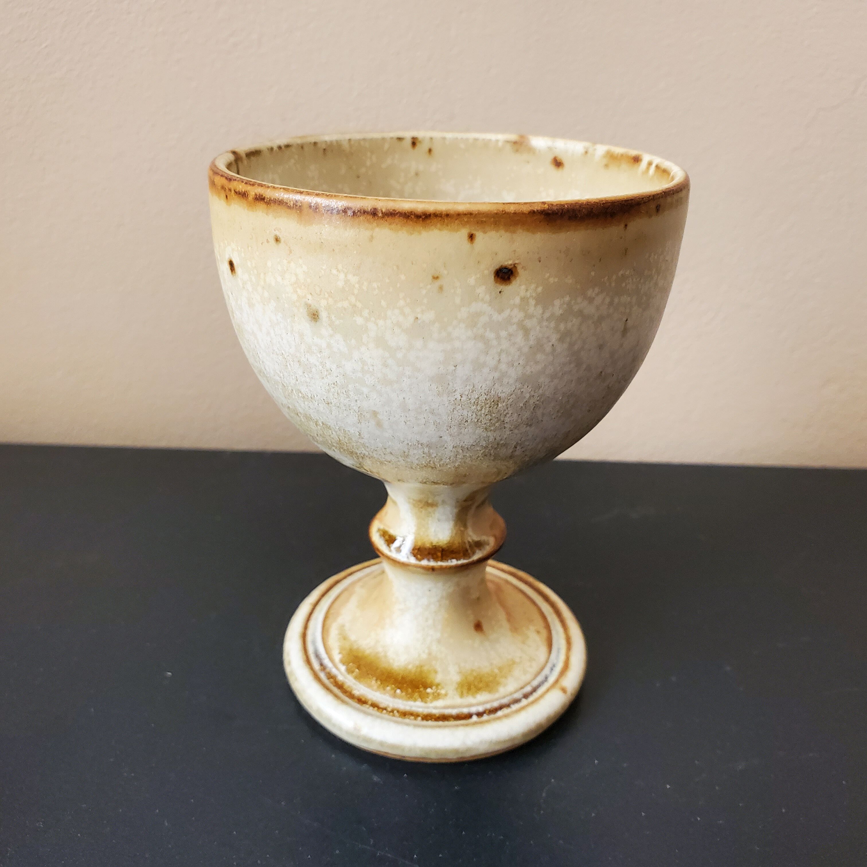 Old glazed sandstone chalice glass