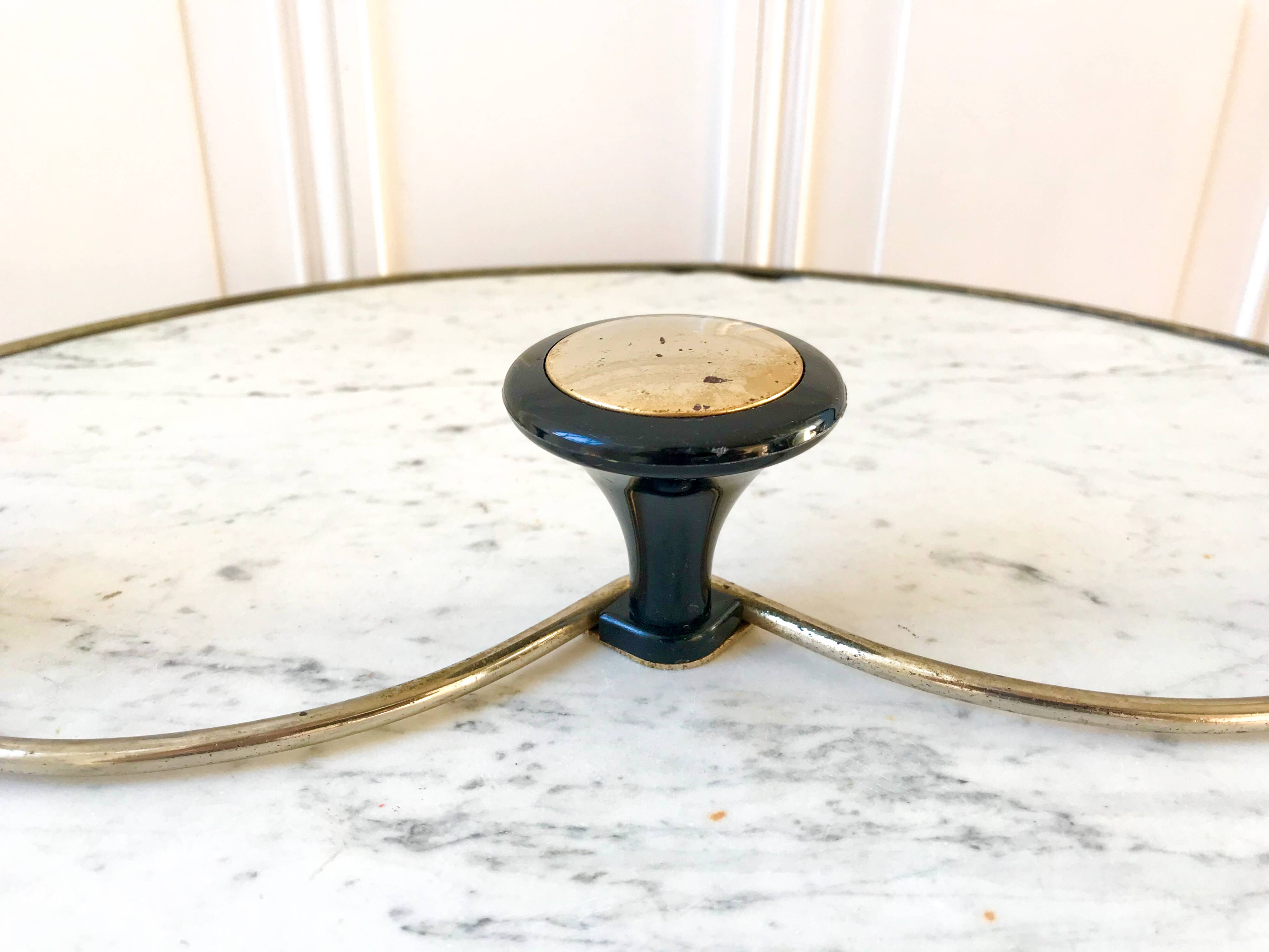 silver and black metal coat hook from the 70s