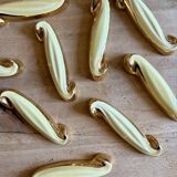 Set of 12 vintage art deco yellow and gold ceramic knife rests