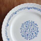 Round antique earthenware dish with floral decoration