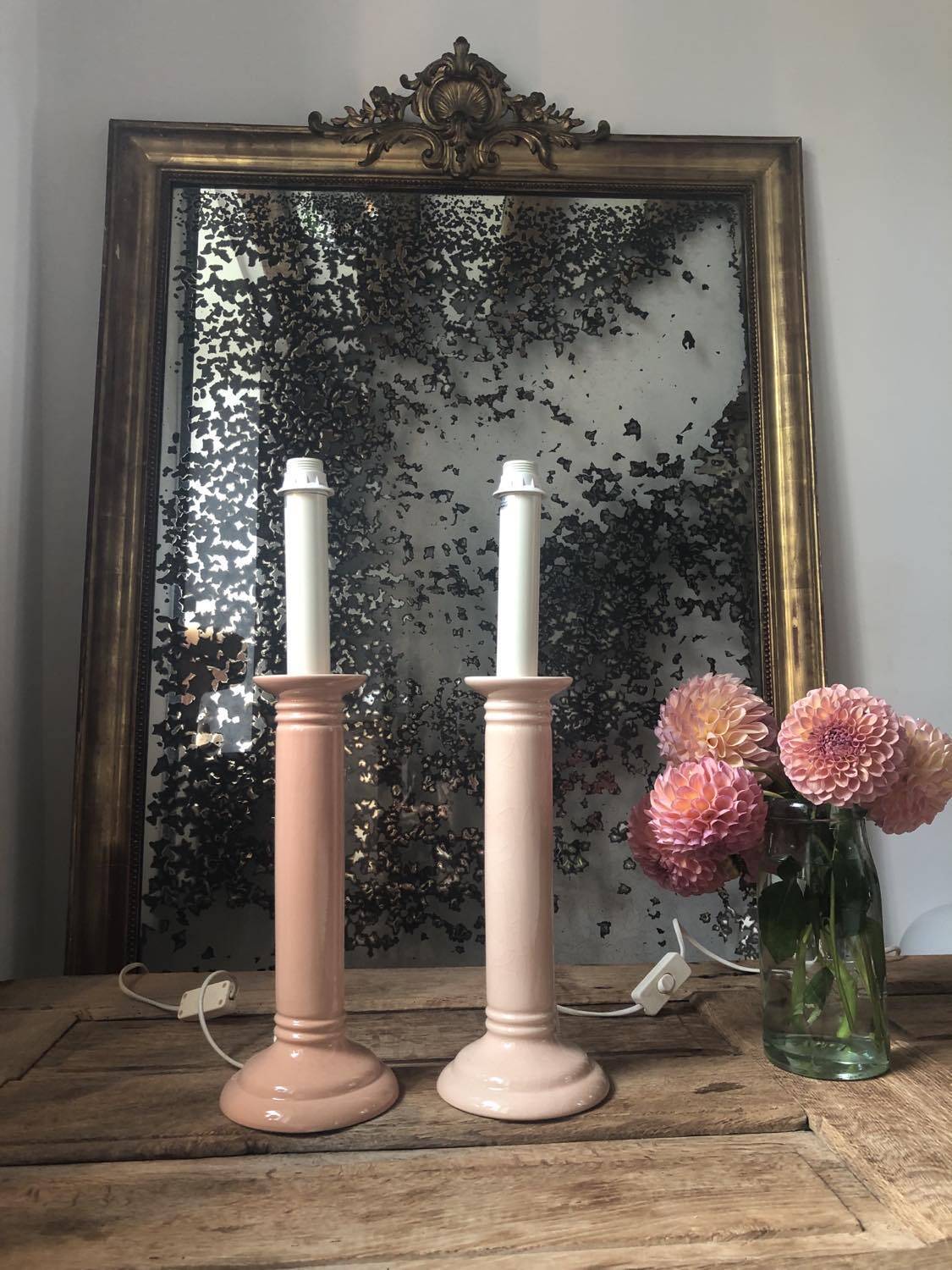 Pair of vintage salmon pink candlestick shaped ceramic lamp bases