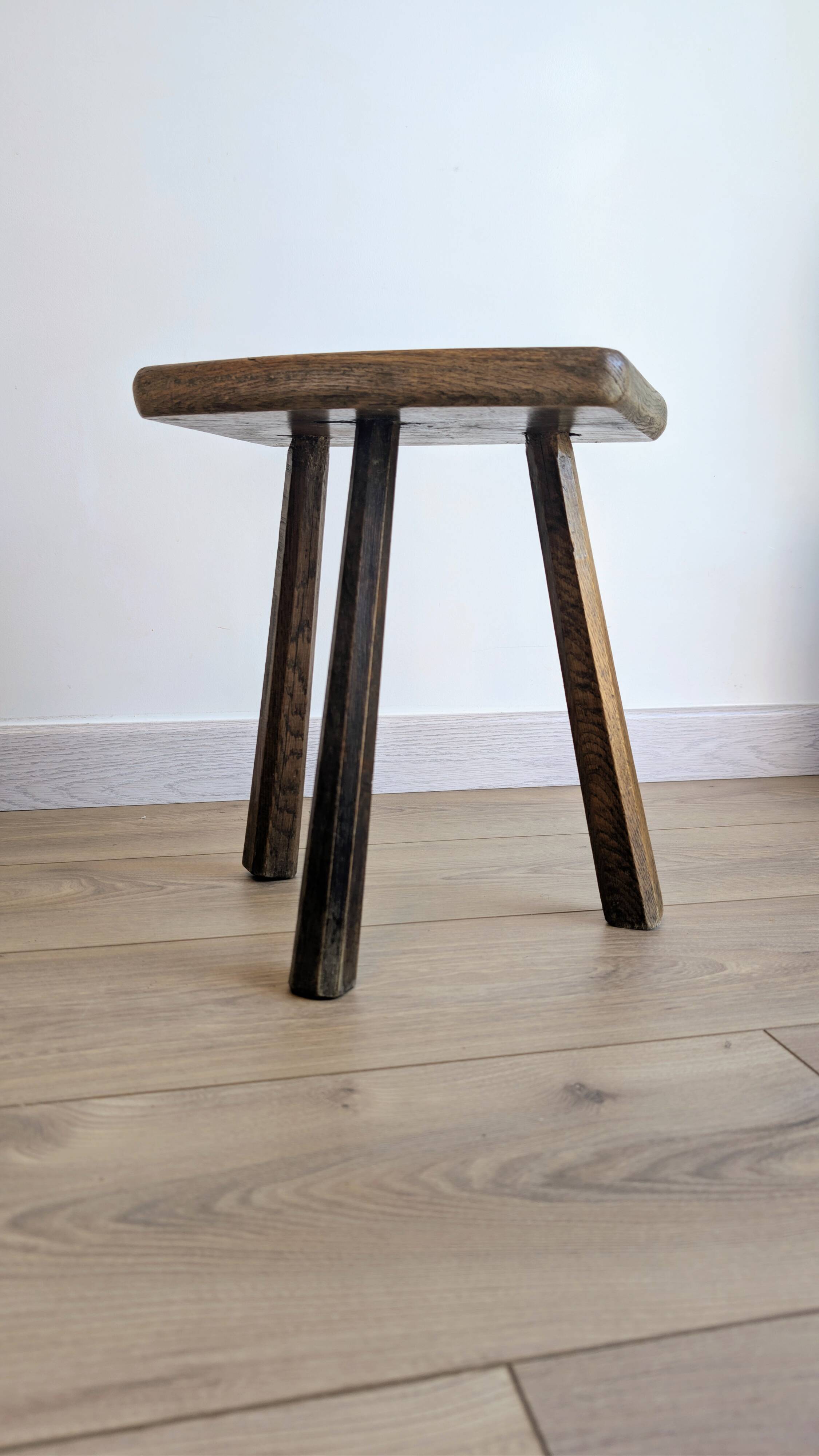 Antique tripod stool in patinated solid wood