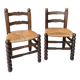 Pair of vintage armchairs with turned wood and woven rope seat.
