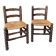 Pair of vintage armchairs with turned wood and woven rope seat.