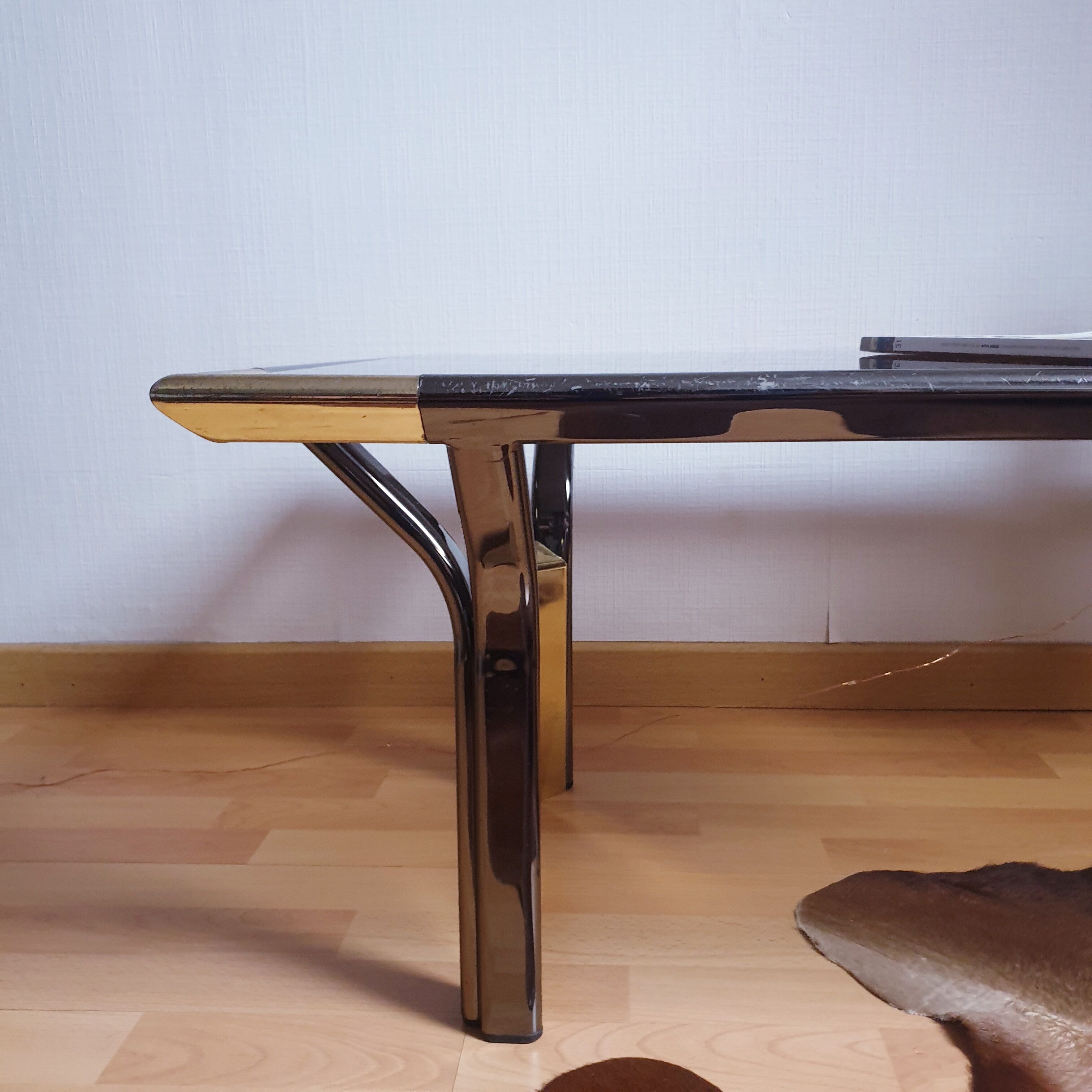 Vintage golden 70s coffee table and space age smoked glass