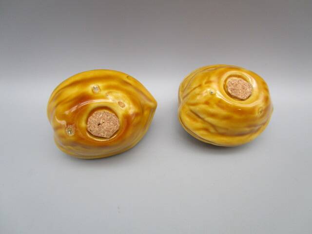 Pair of old earthenware salt/pepper shakers in “walnut” shape