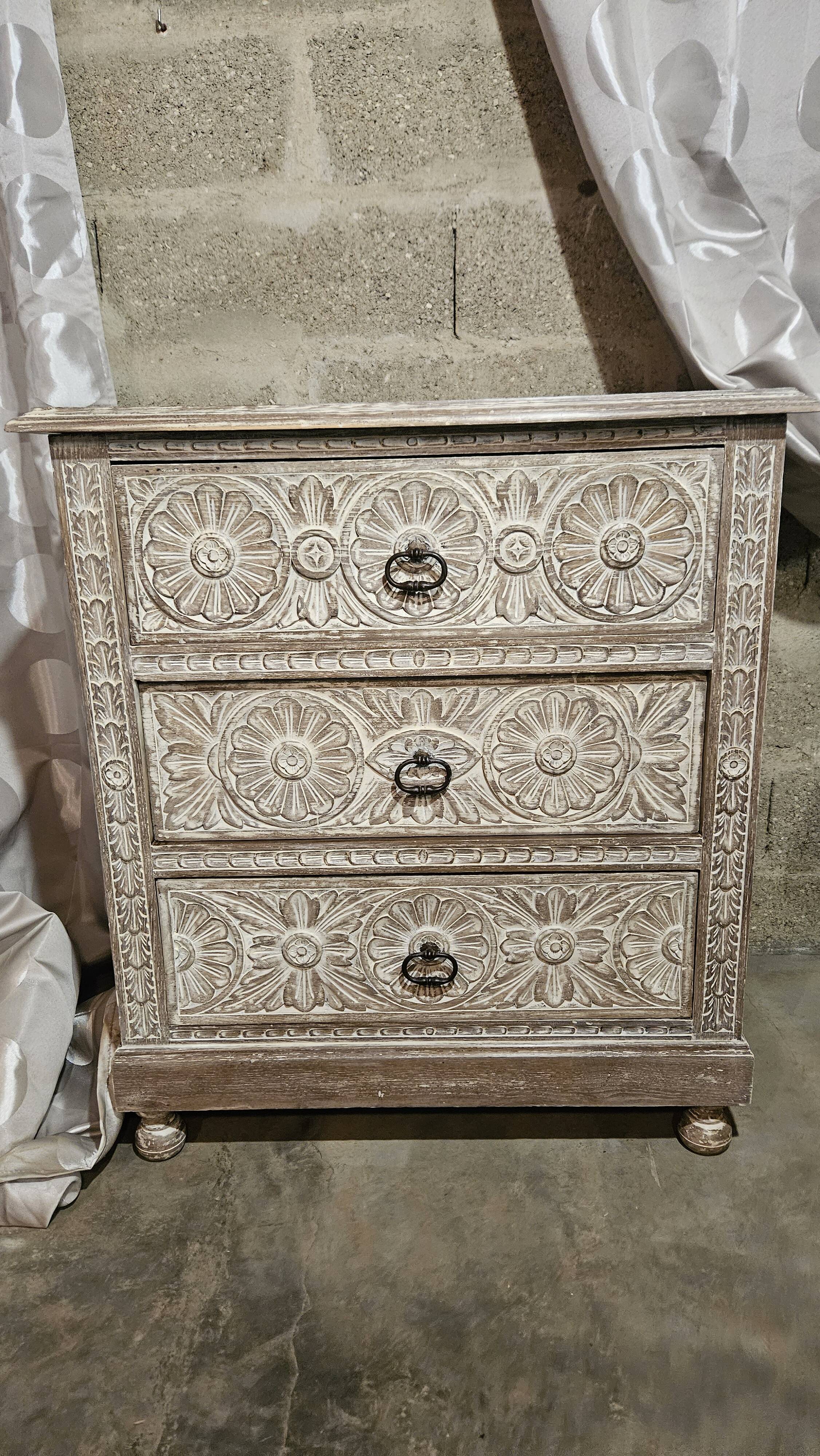 Carved chest of drawers