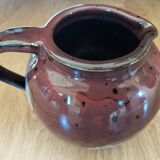 Stoneware pitcher by Matthieu Liévois in shades of red
