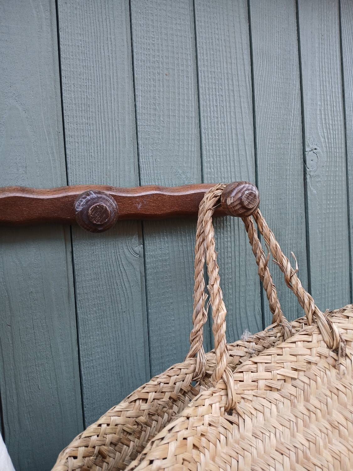 Small antique wooden wall coat rack.