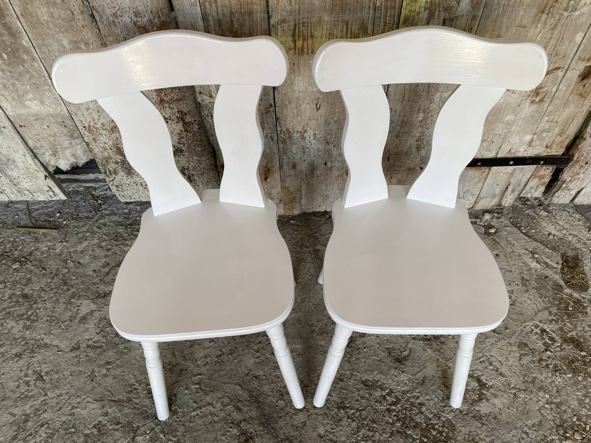 Pair of vintage white wooden bistro chairs