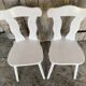 Pair of vintage white wooden bistro chairs