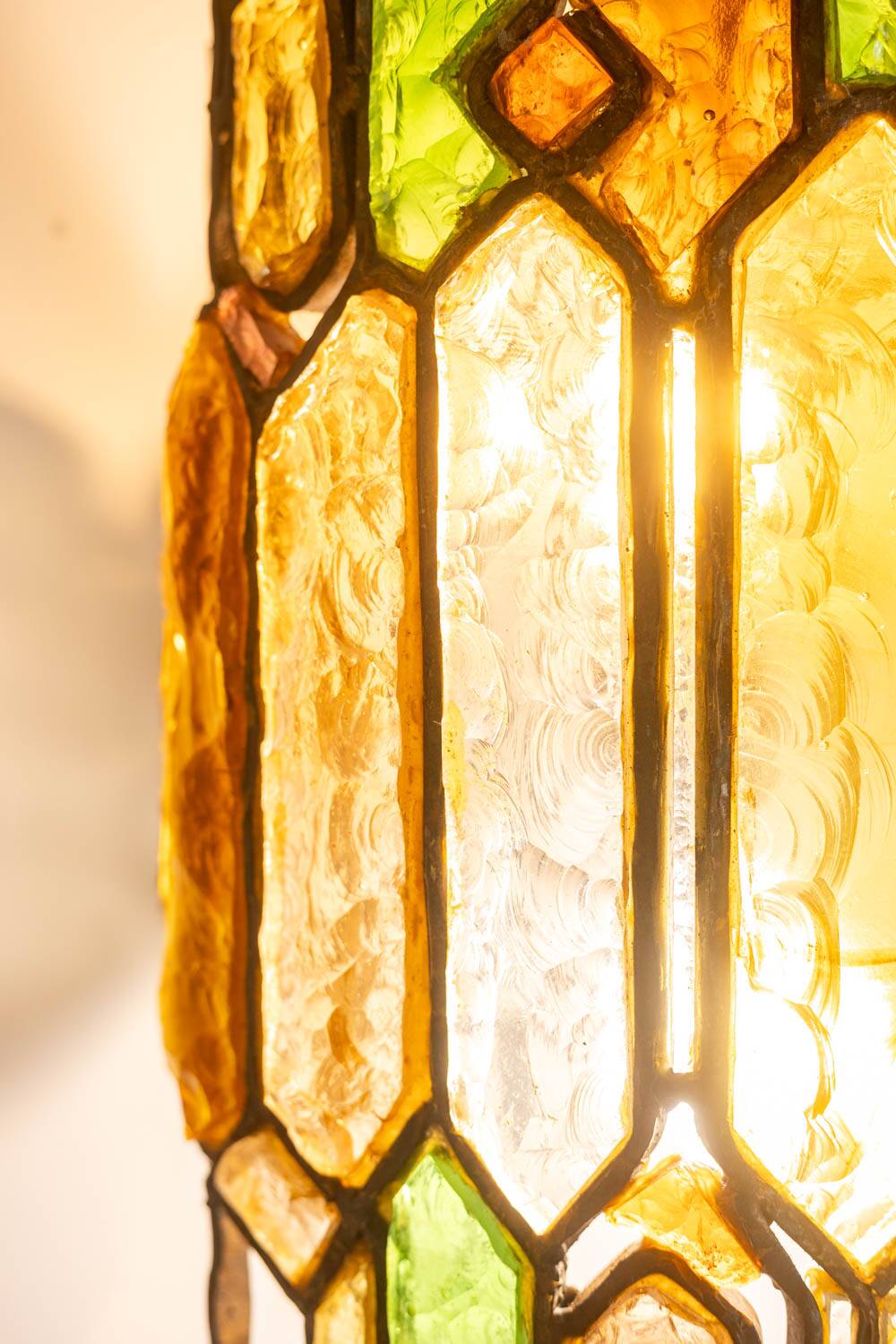 Wrought iron and colored glass wall light. 1960s.