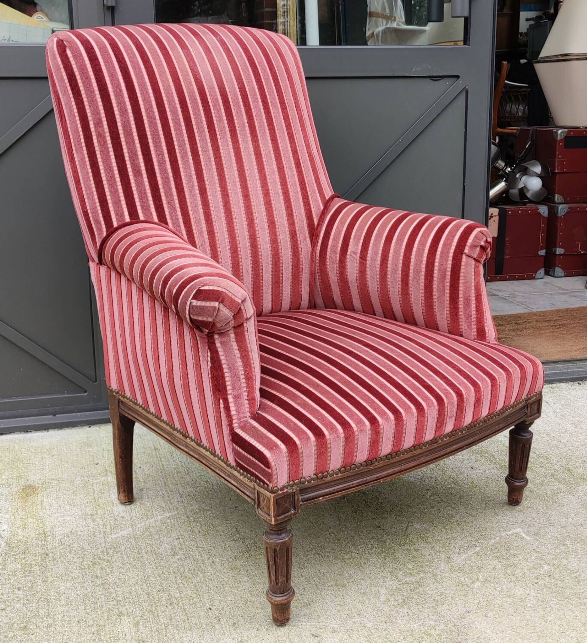 Old armchair and its Louis XVI style footrest/velvet covering