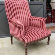 Old armchair and its Louis XVI style footrest/velvet covering