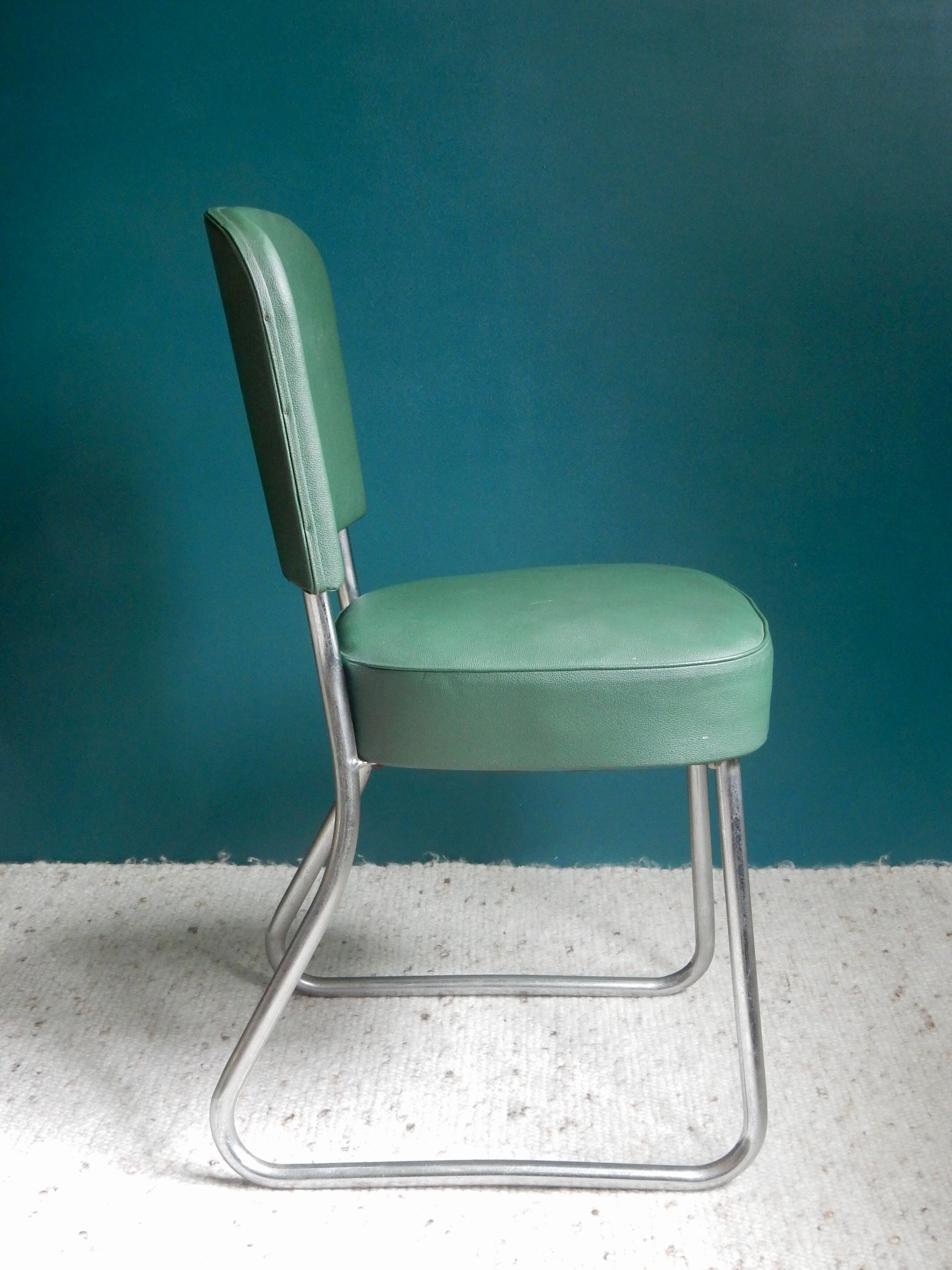 Office chair in green skaï
