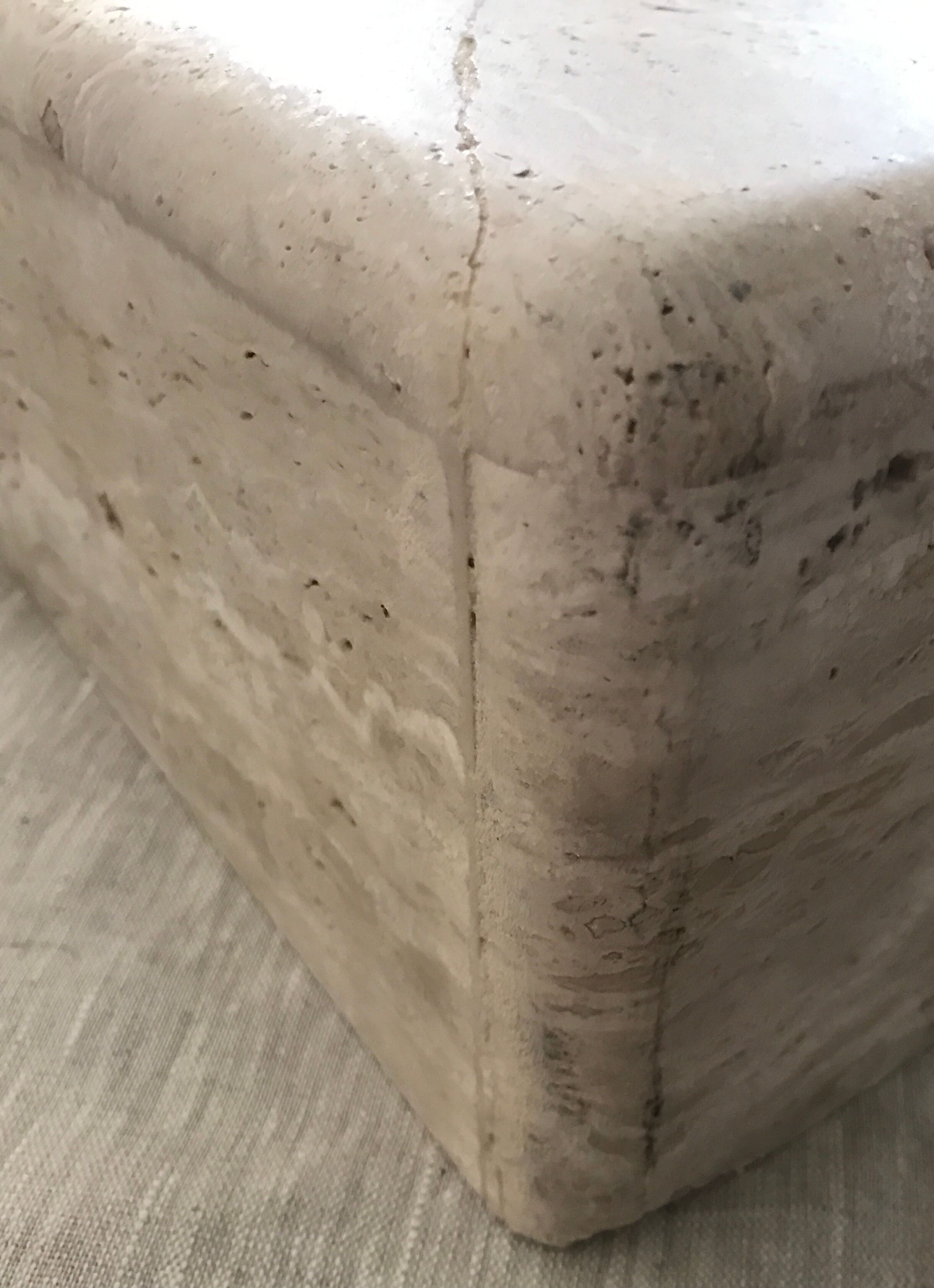 Sculptural travertine coffee table