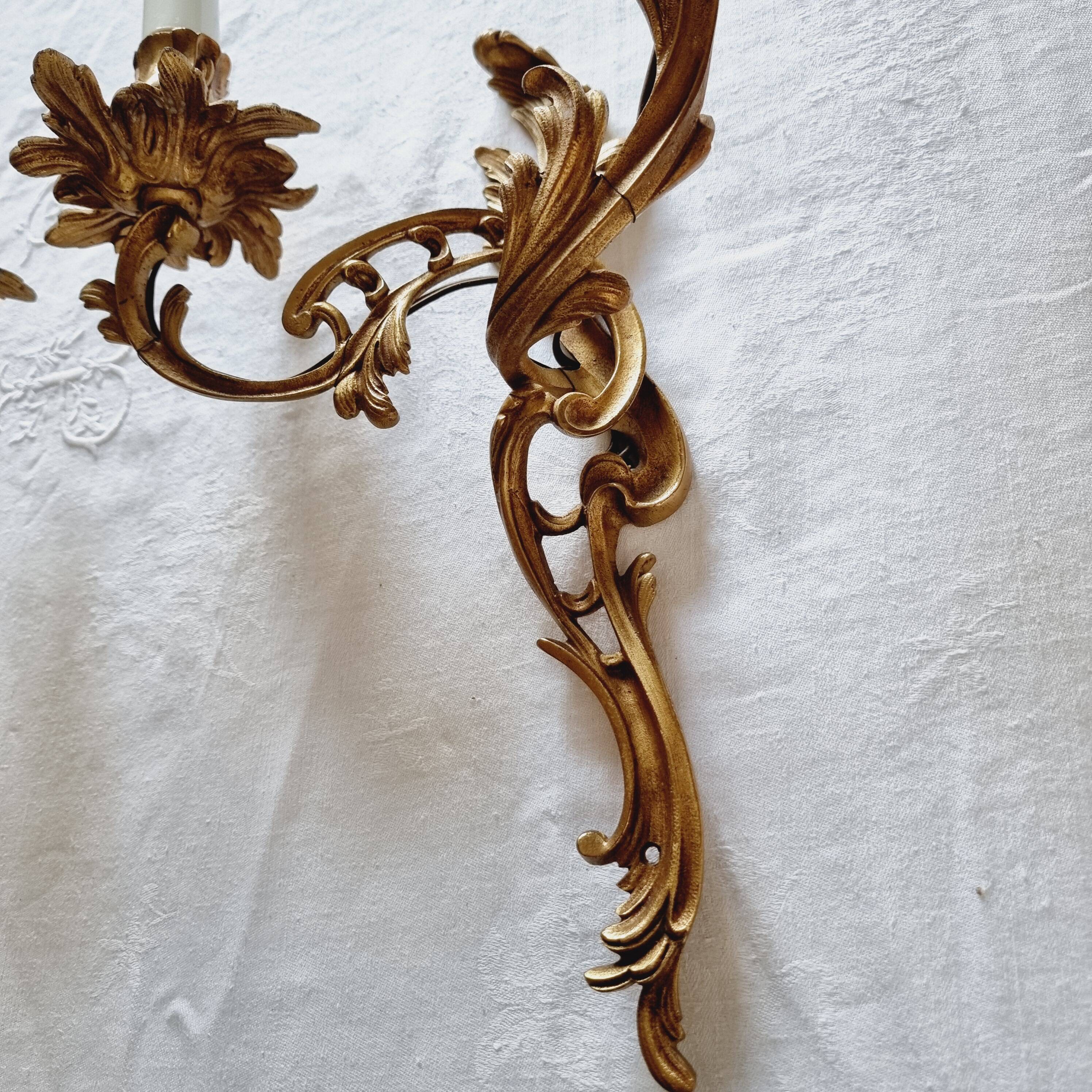 Pair of vintage French wall sconces in bronze, Louis XV Rococo style.