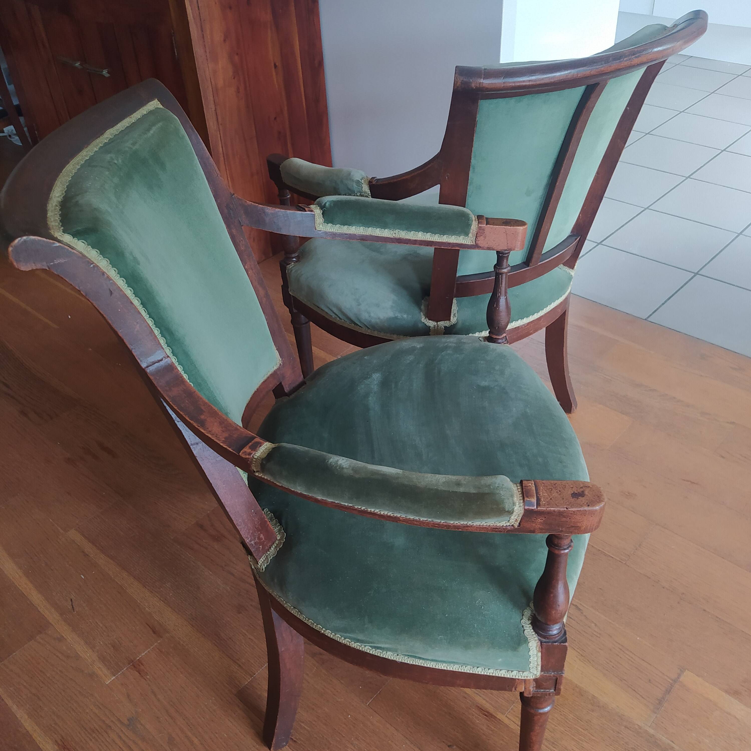 pair of Directoire armchairs in walnut, early 19th century, green velvet