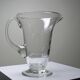 Antique glass pitcher with wheel engraving and floral decoration, Bohemia, early 20th century.
