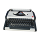 Revised typewriter and Olympia Traveller luxury with his satchel