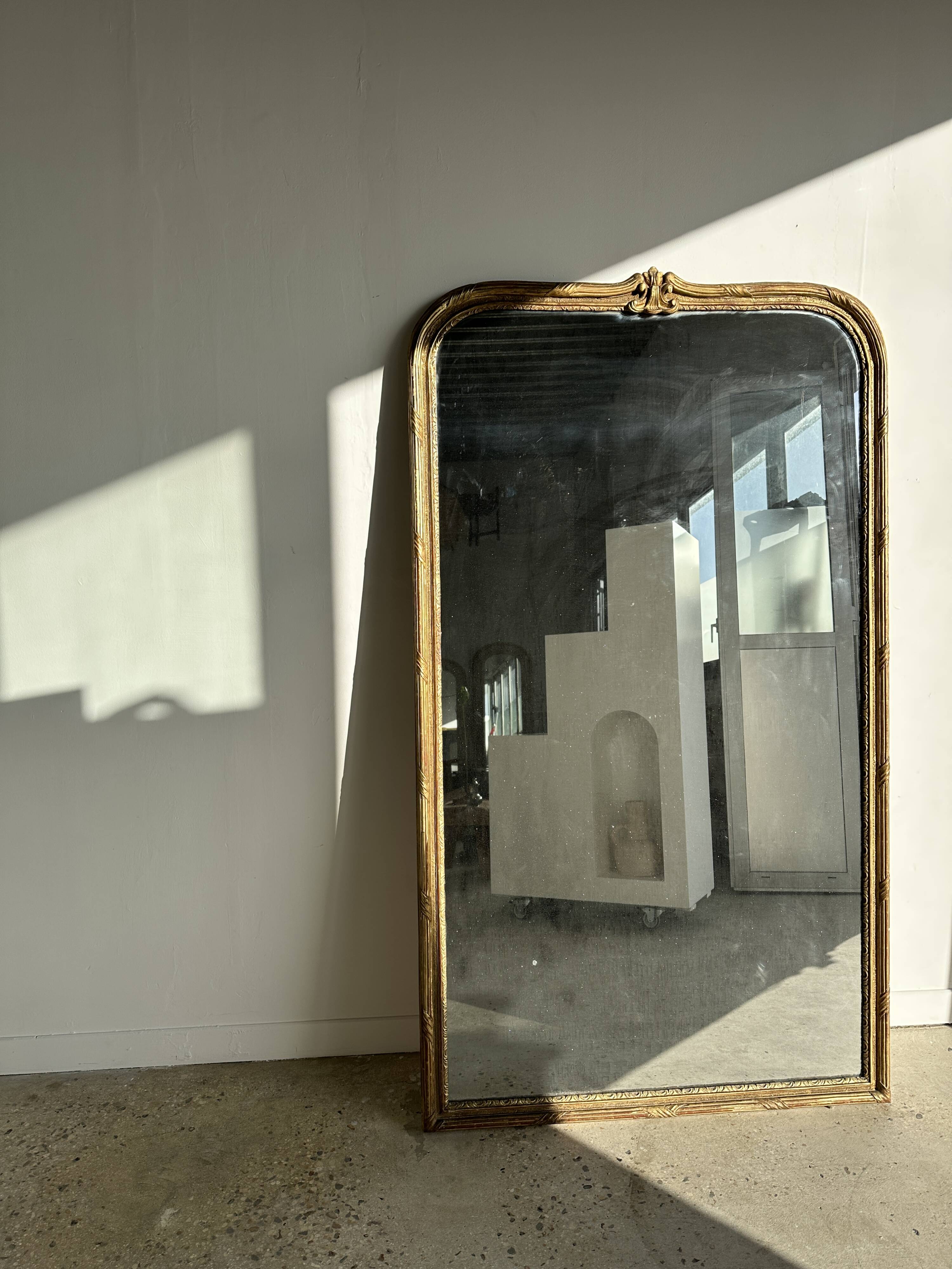 Large gilded mirror 19th century rounded corners mercury glass Louis XVI style