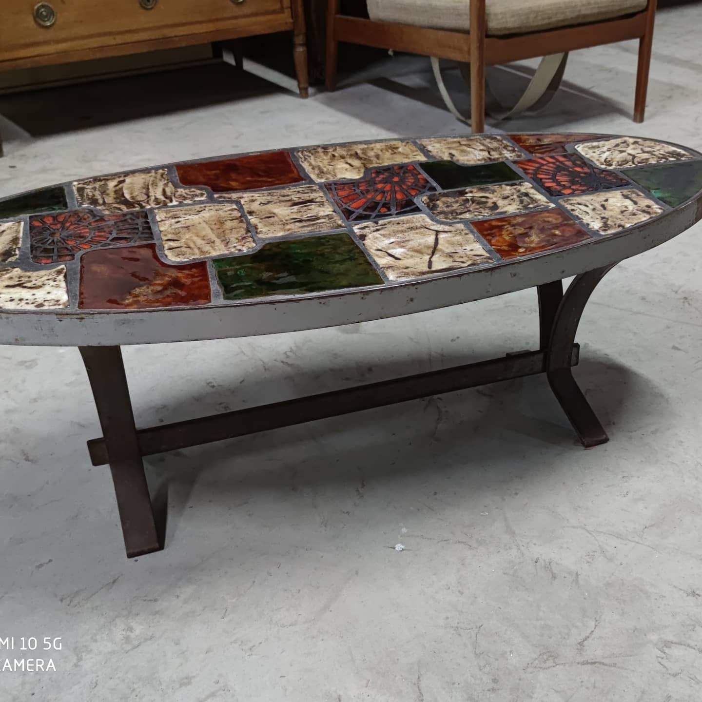 Ceramic and steel elliptical table