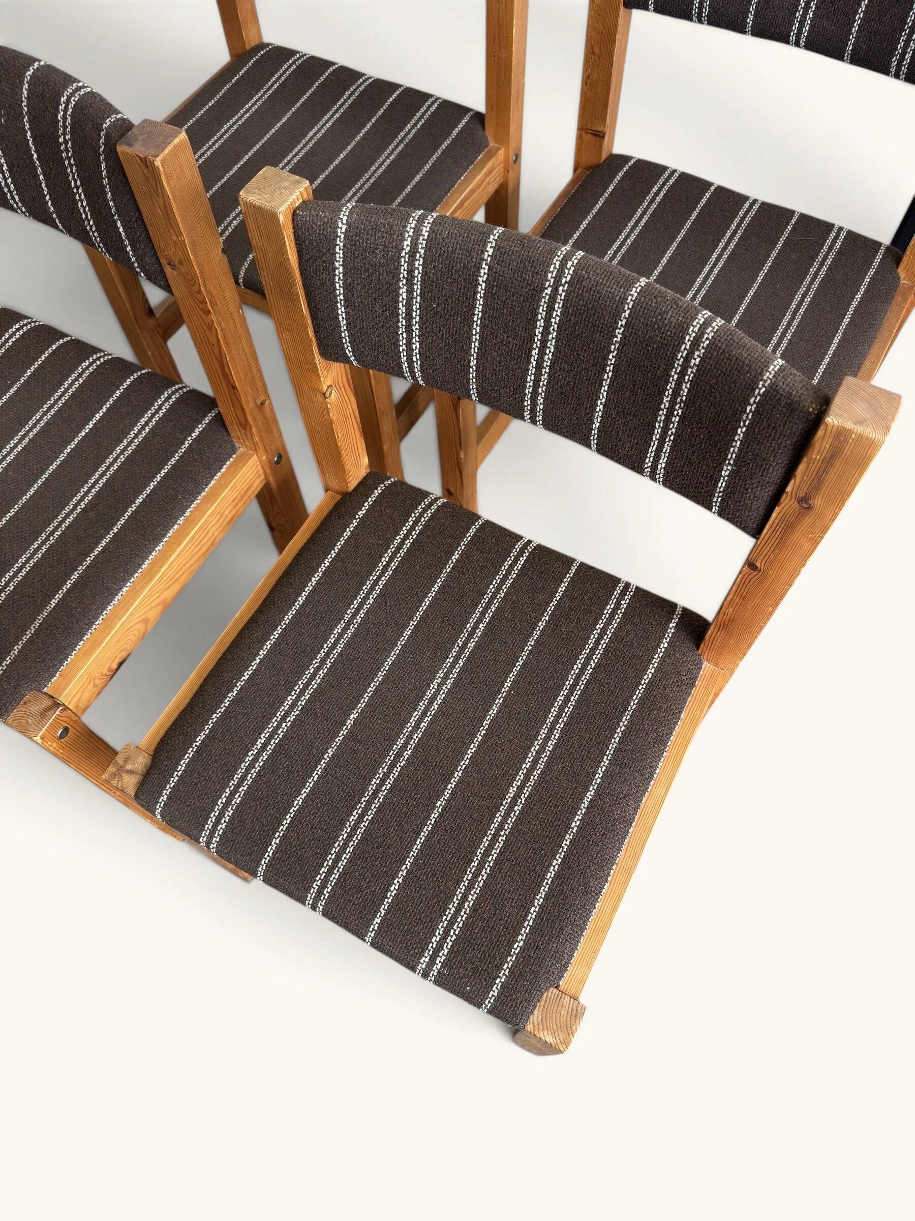 Set of 4 Danish dining chairs with brown striped upholstery.
