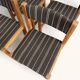 Set of 4 Danish dining chairs with brown striped upholstery.