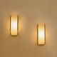 Pair of modernist wall sconces in nickel-plated steel and opaline glass, 1930.