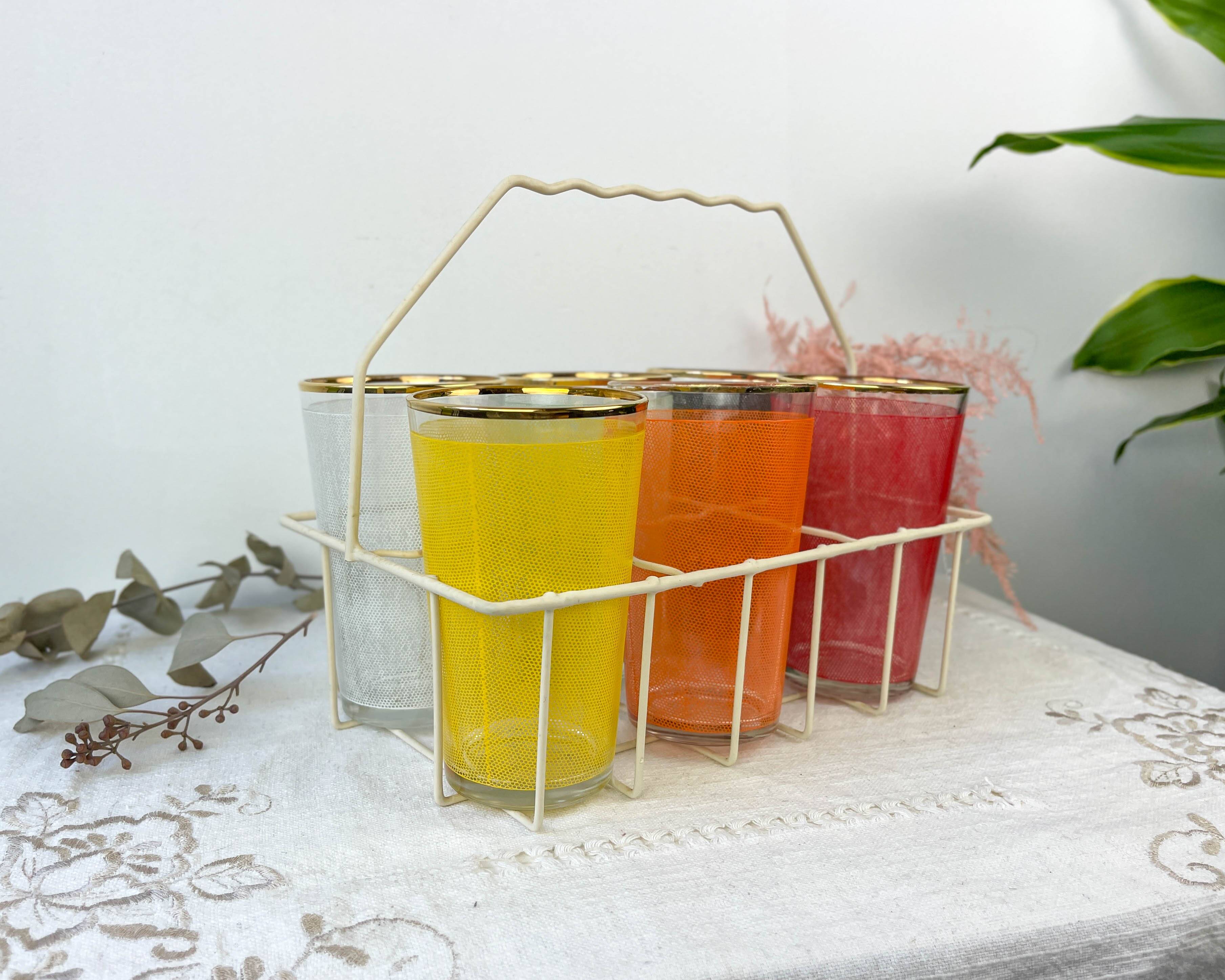6 colorful juice glasses in their vintage basket