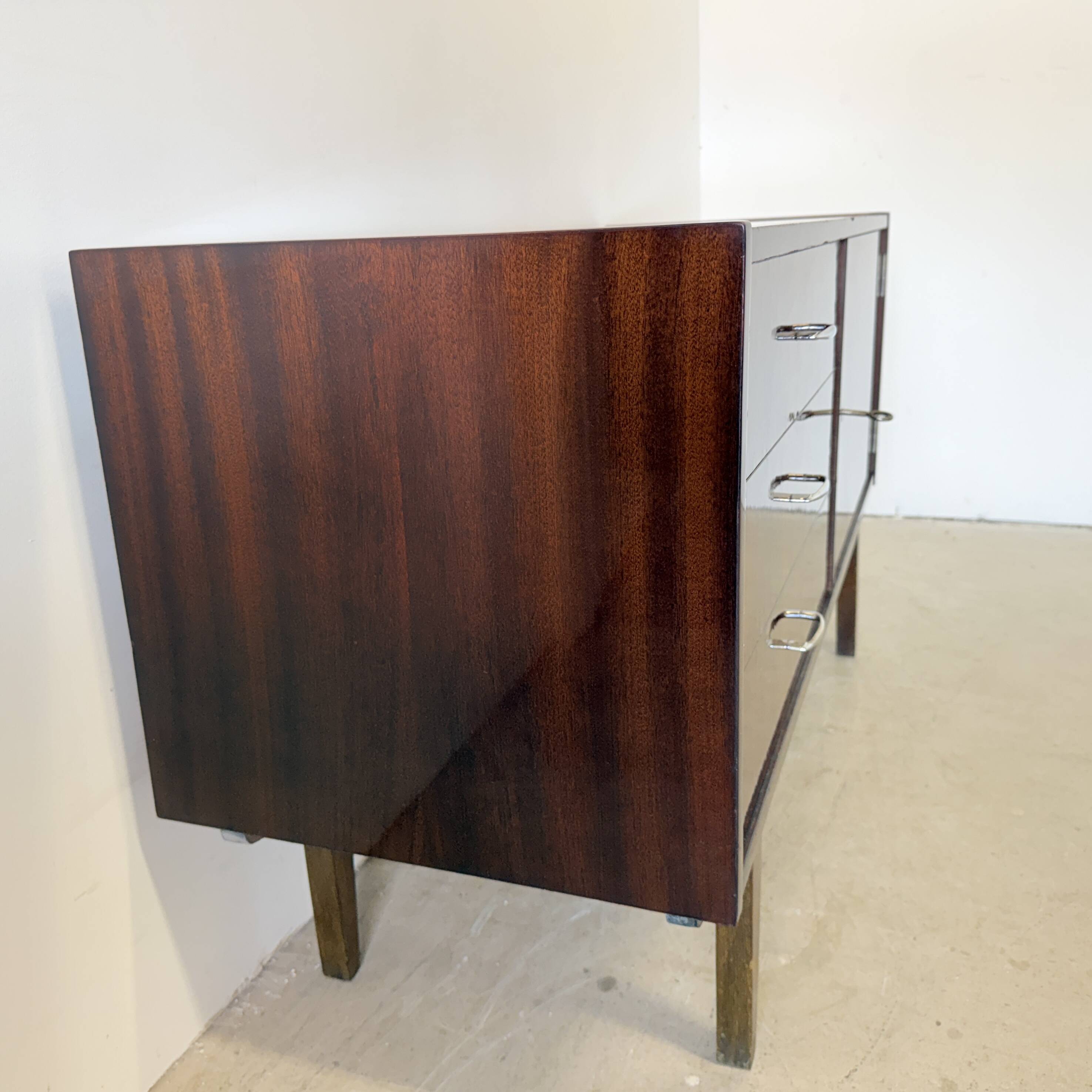 Subtle high-gloss sideboard in Scandinavian style