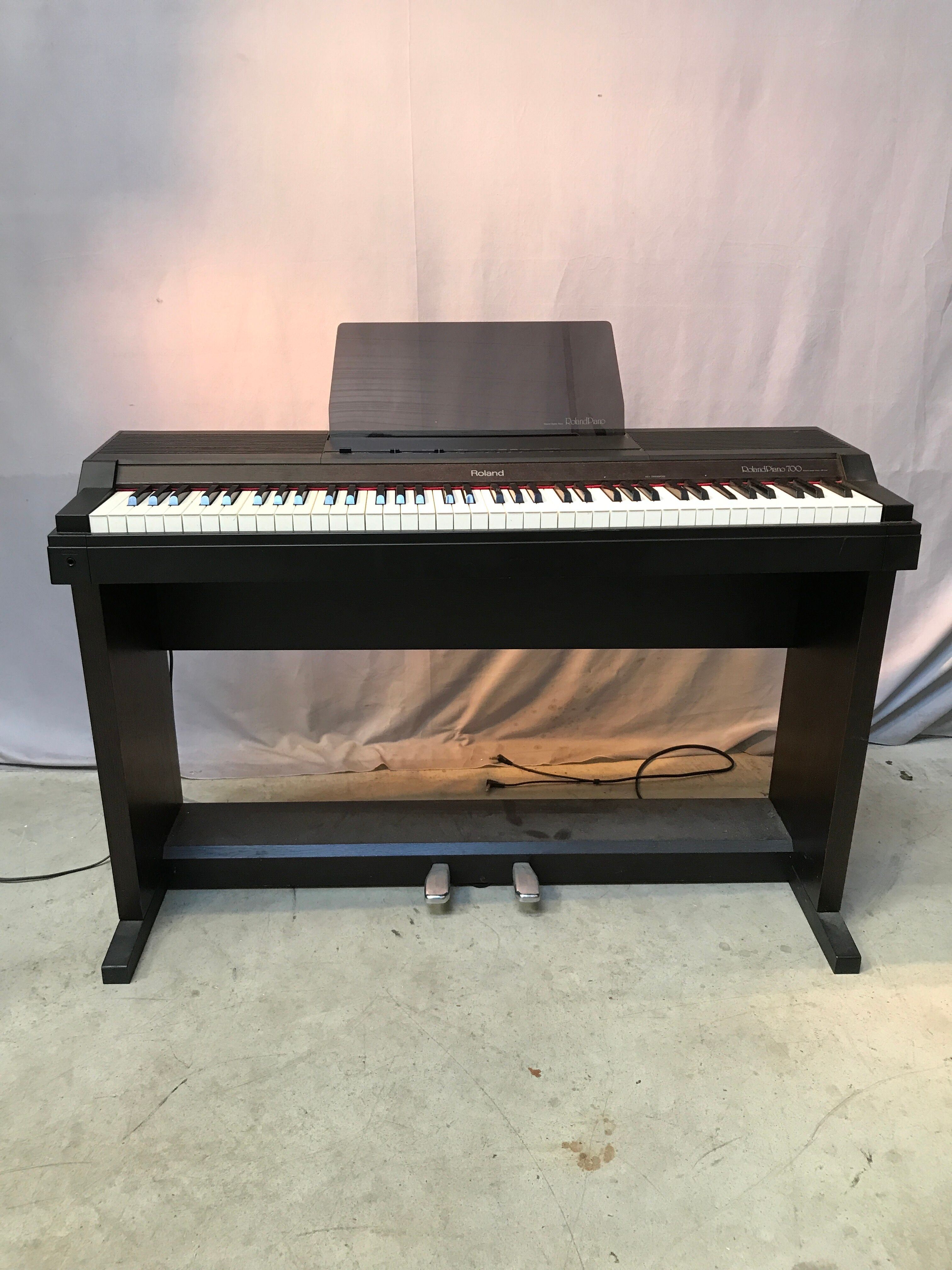 Roland HP 700 keyboard and its stand with pedal