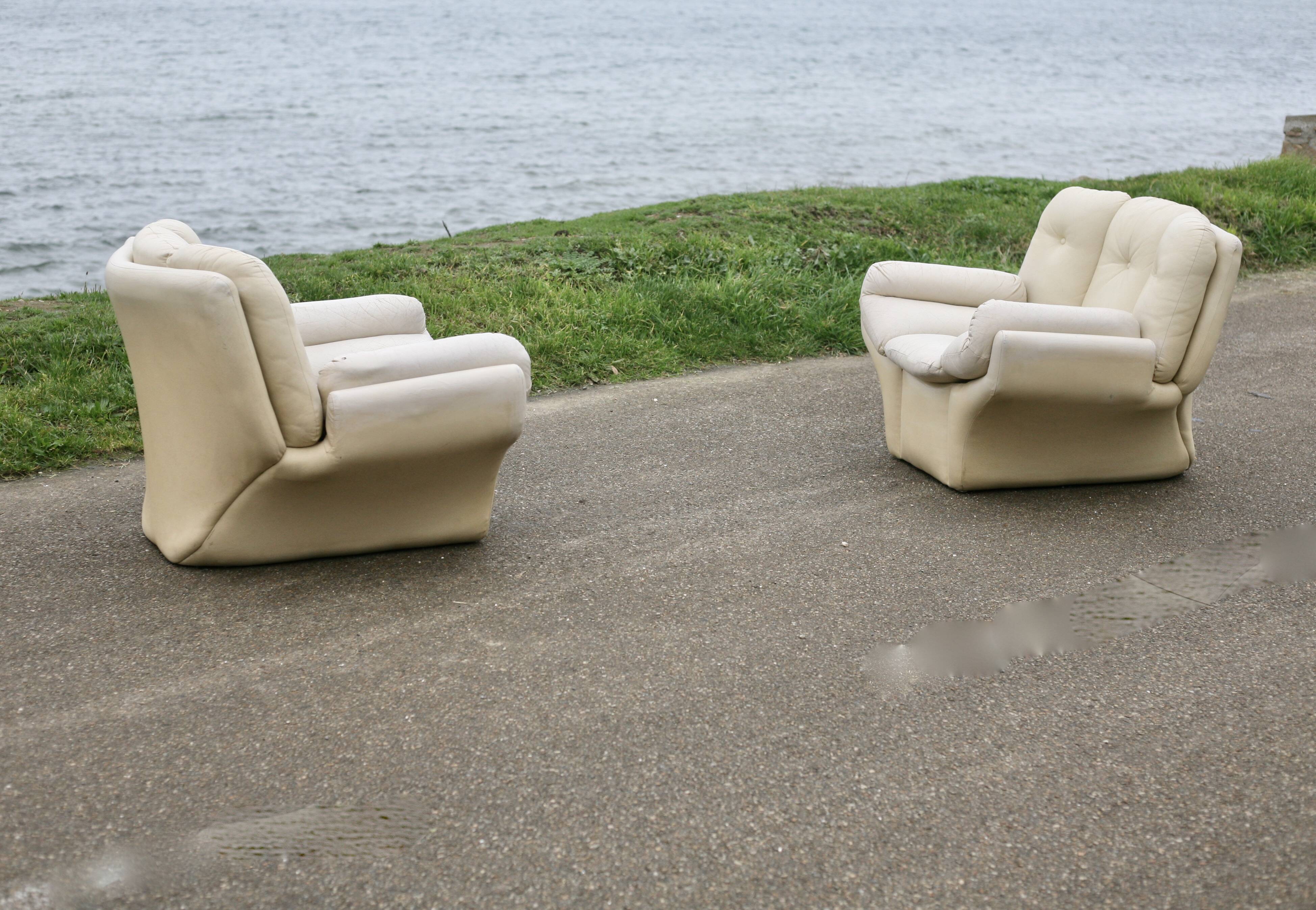 Pair of leather “space age” armchairs. Cream colour". Circa 1970.