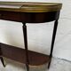 Louis XVI demi-moon console in wood and brass.