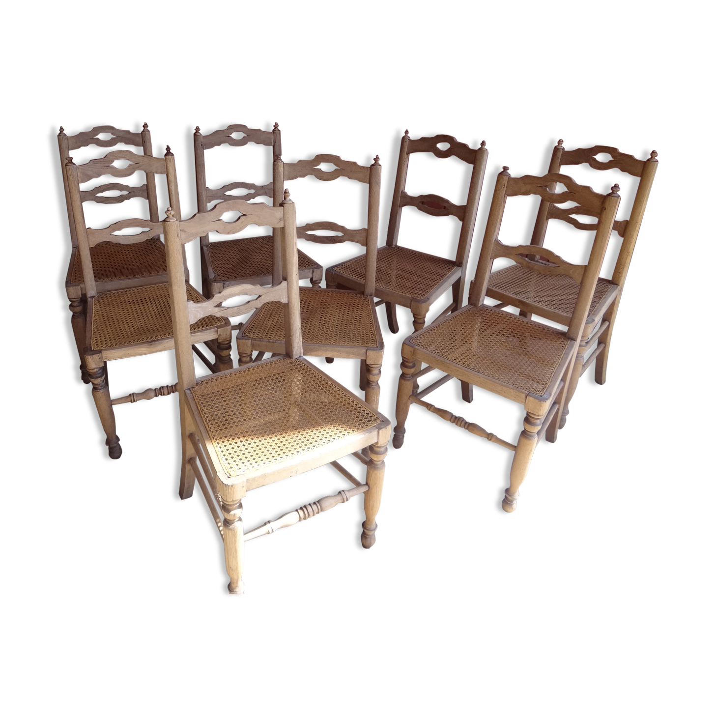 Suite of oak chairs; canated seats