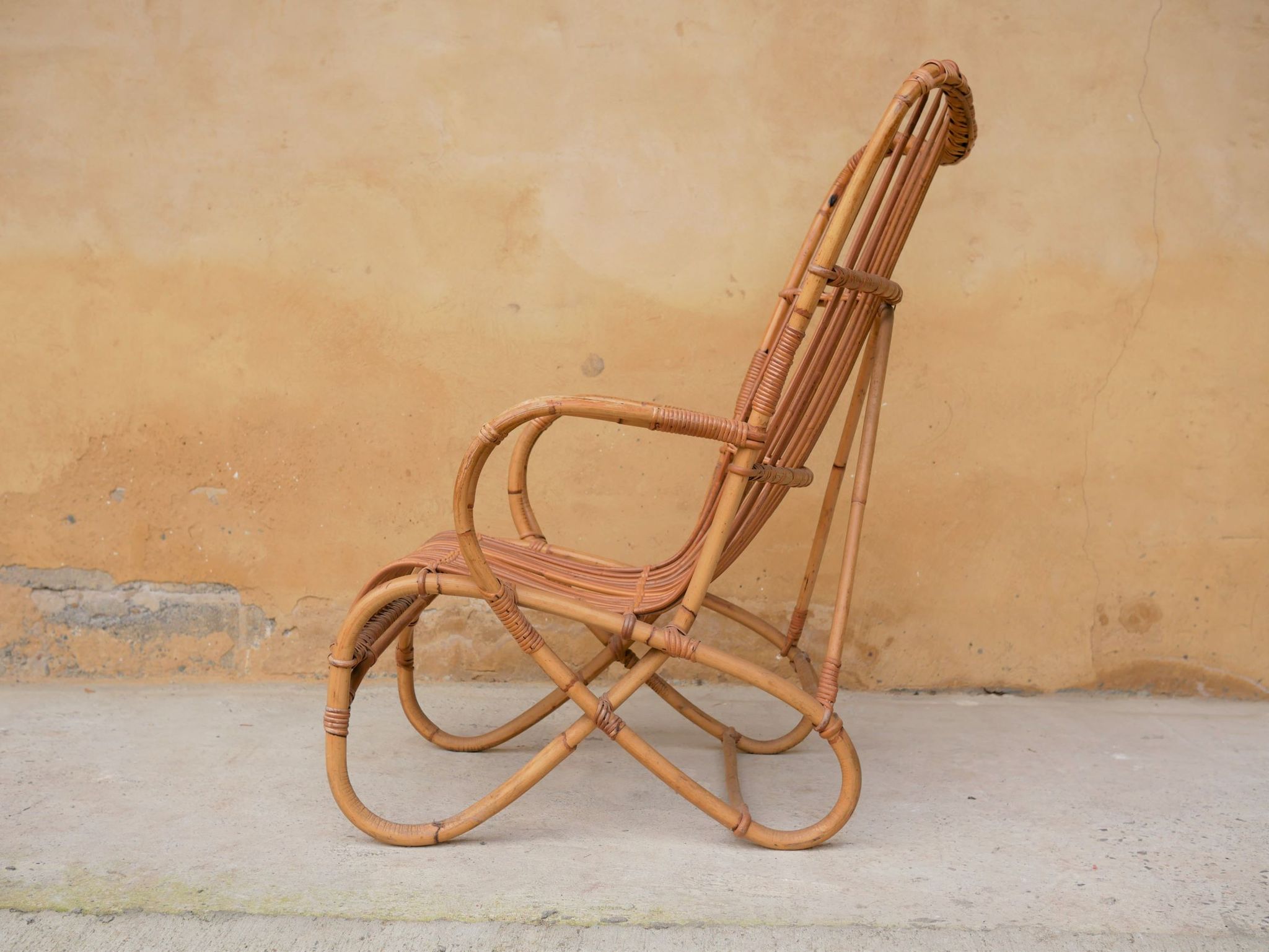 Vintage rattan chair by Louis Sognot