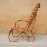 Vintage rattan chair by Louis Sognot