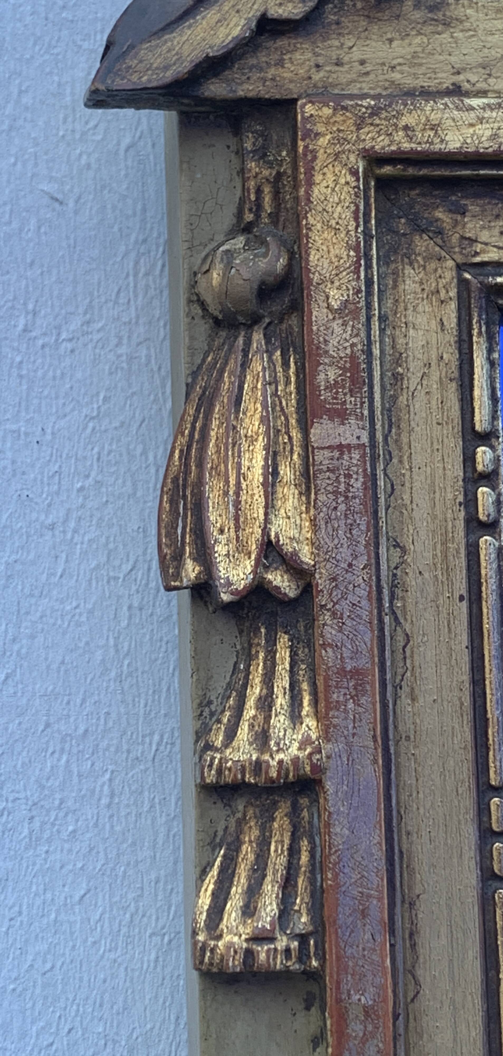 Antique mirror with gilded wood pediment, Louis XVI style