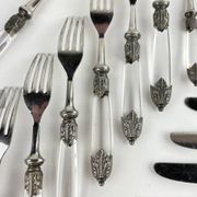 Silver-plated metal cutlery set, plexiglass and stainless steel.