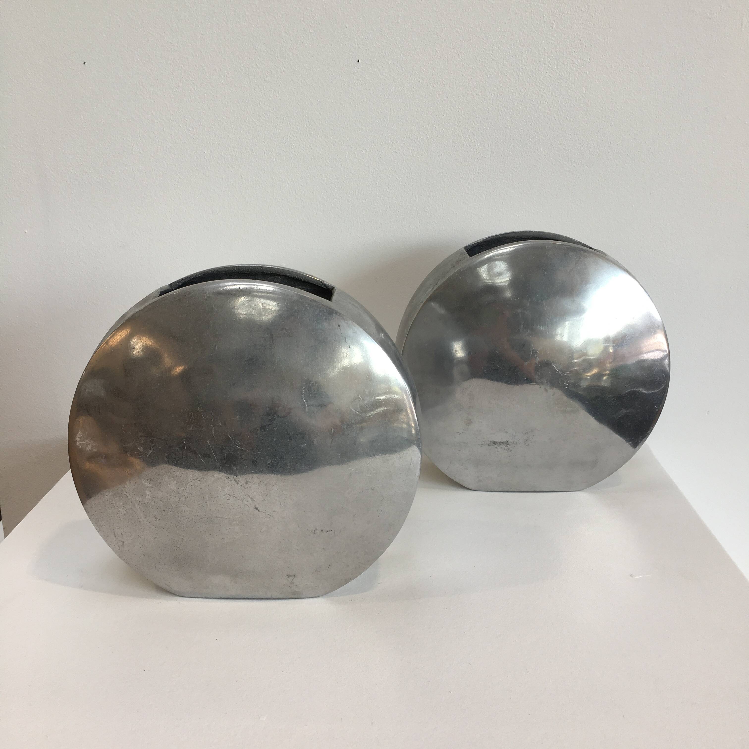 Series of two 70s style aluminum vases
