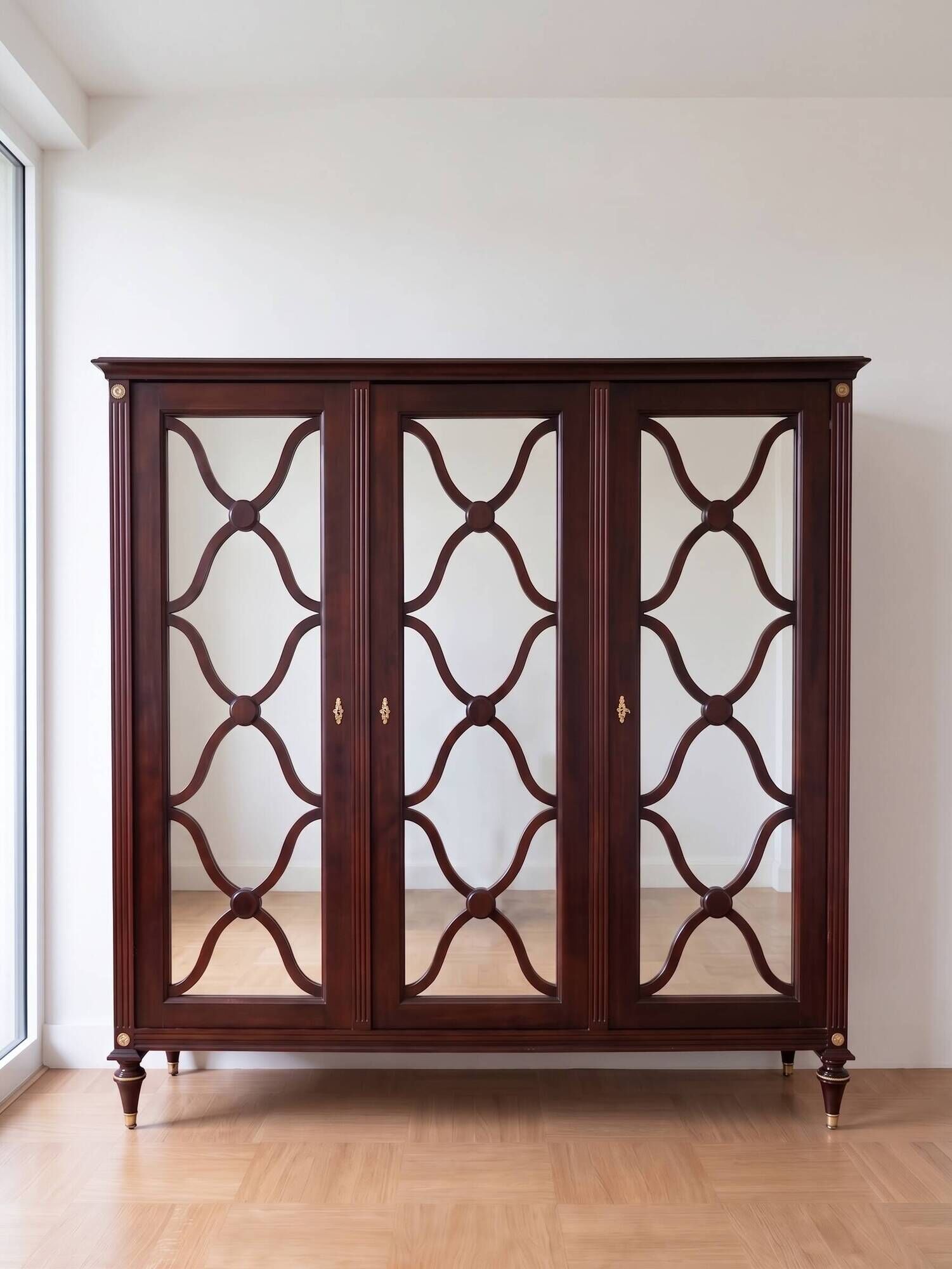 Large antique mahogany wardrobe with 3 mirror doors from the early 20th century.