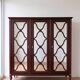 Large antique mahogany wardrobe with 3 mirror doors from the early 20th century.