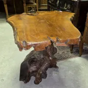 Sculpted olive wood table, made from a root.