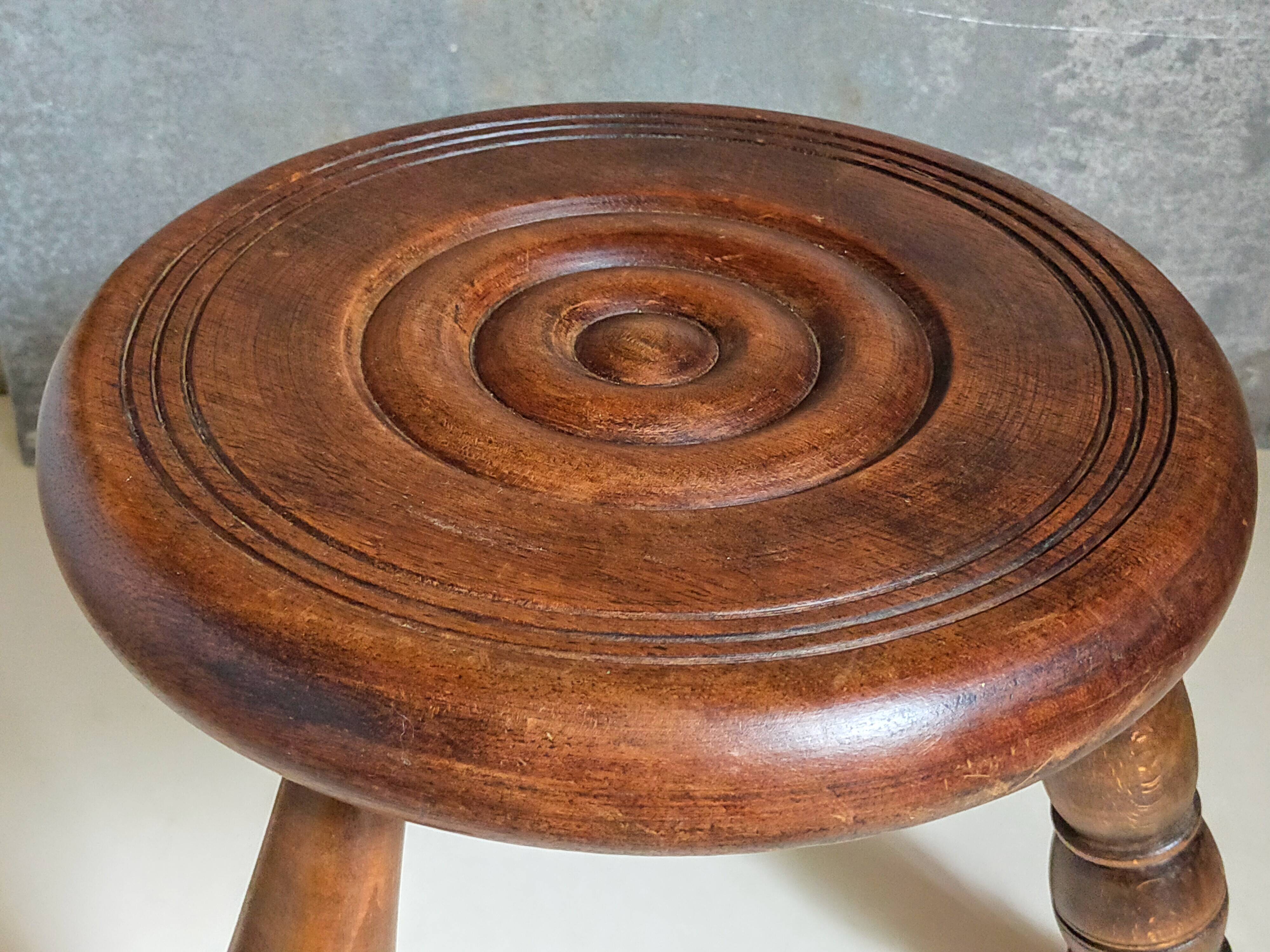 Low tripod stool in vintage turned solid wood