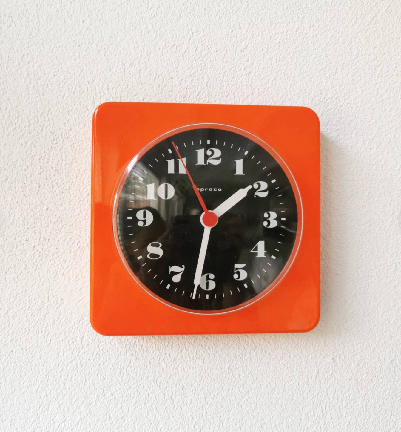 Vintage orange wall clock made of Inproco plastic, 1970