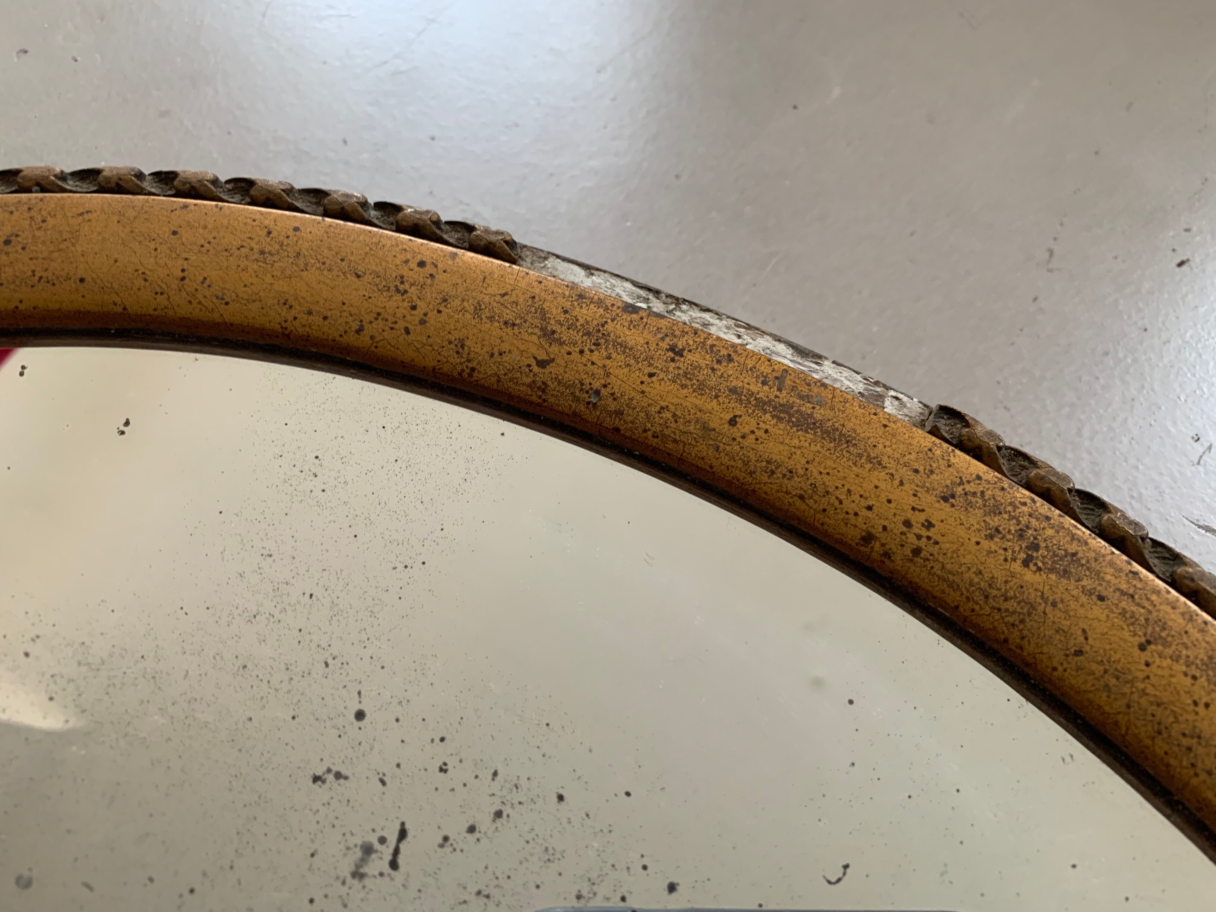 Old oval mirror stitched