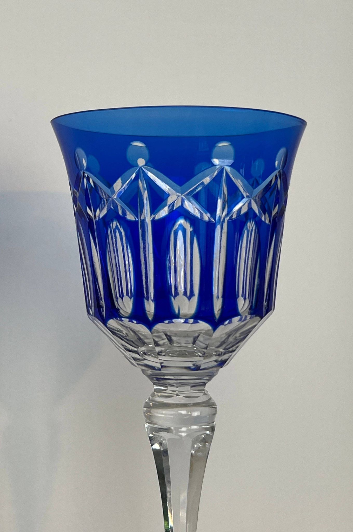 Set of twelve glasses in crystal tinted in different colours and cut with stars.