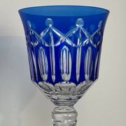 Set of twelve glasses in crystal tinted in different colours and cut with stars.